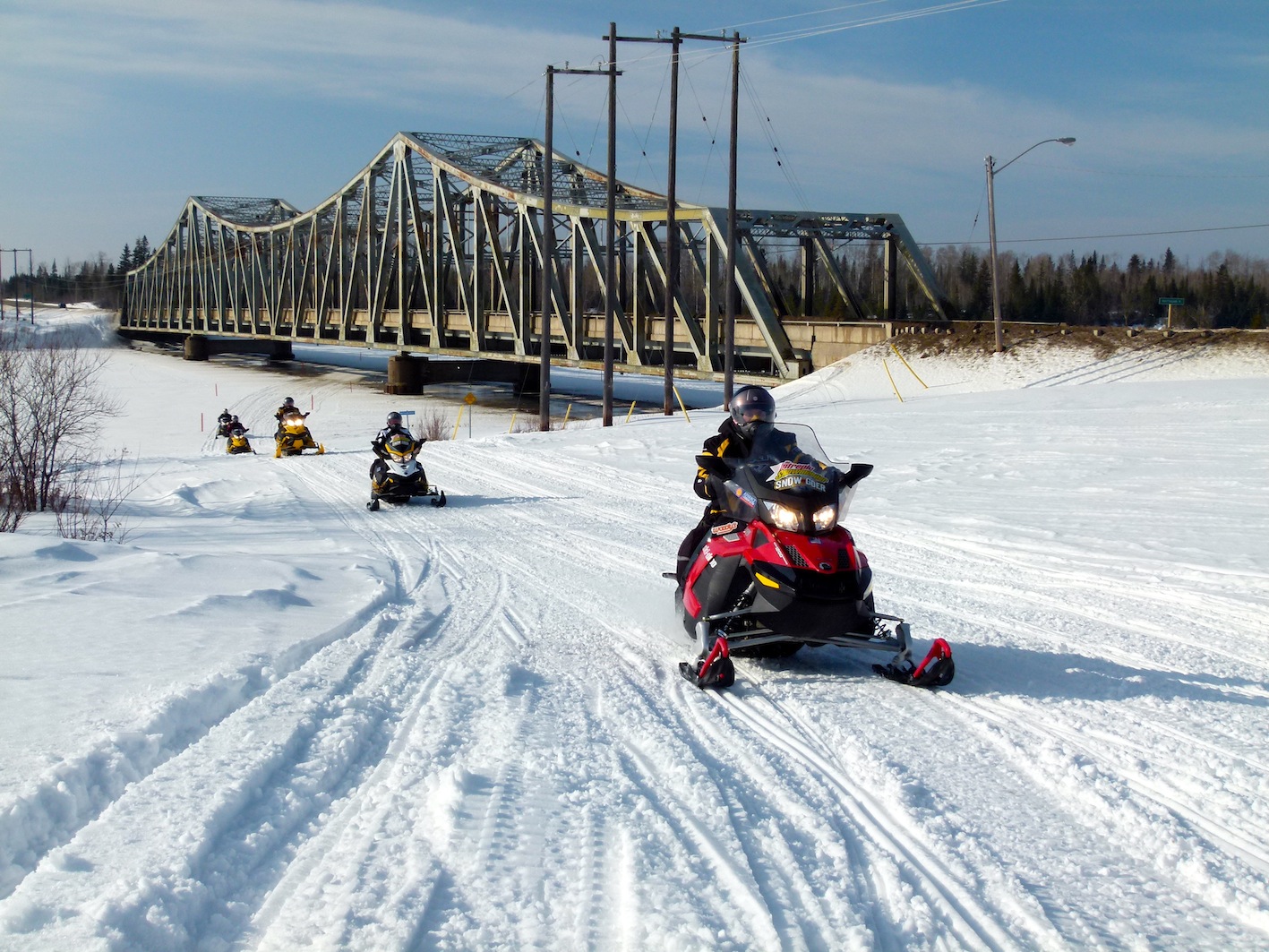 Northern Corridor snowmobiling Crossing under the Mattagami River Bridge at Smooth Rock Falls on TOP A trail.