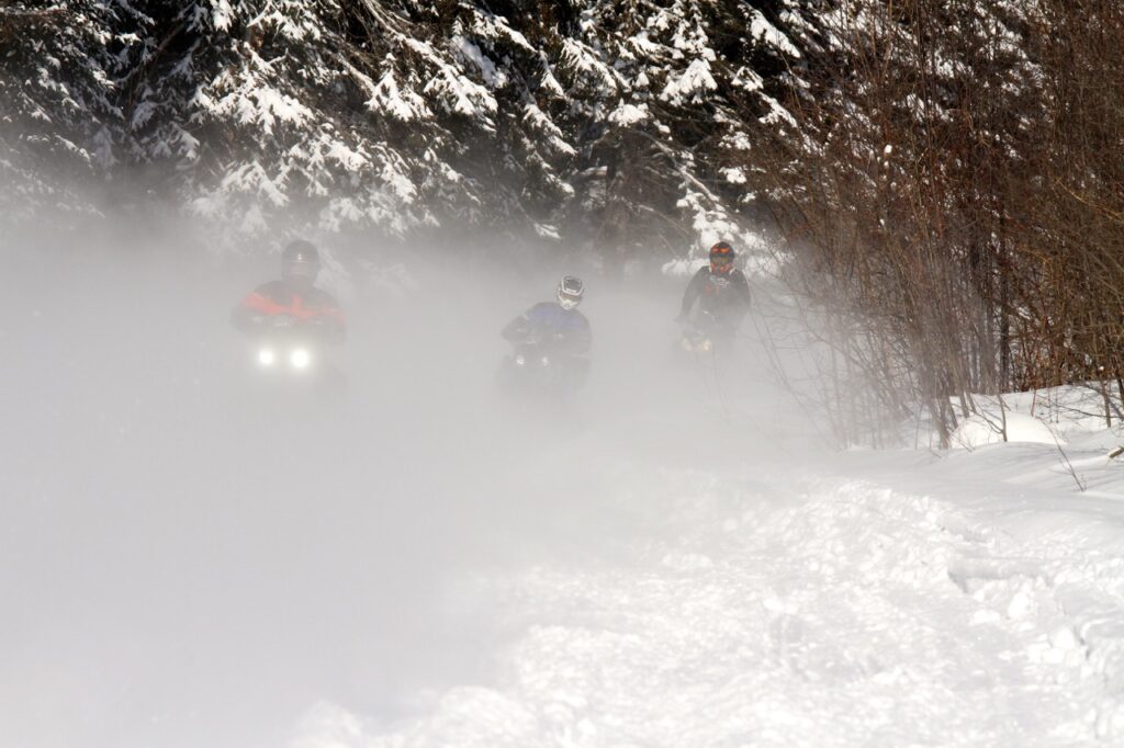 Snowmobile Snow Dust can blind following riders.
