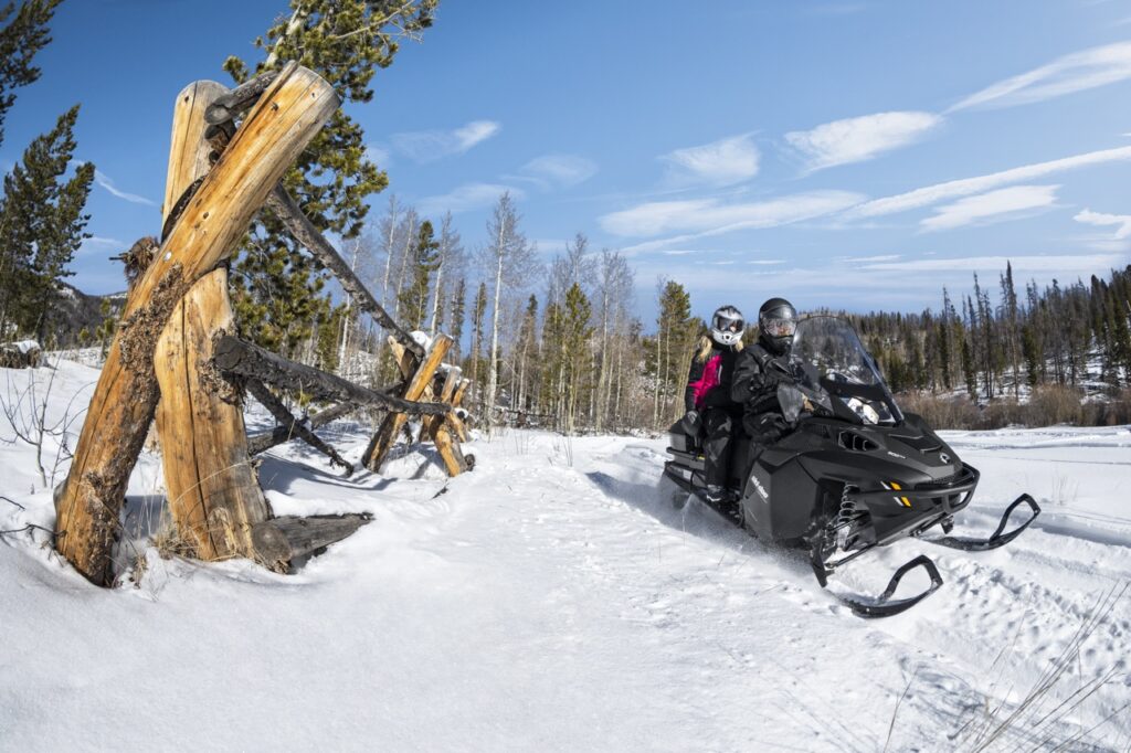 snowmobiling double near fence