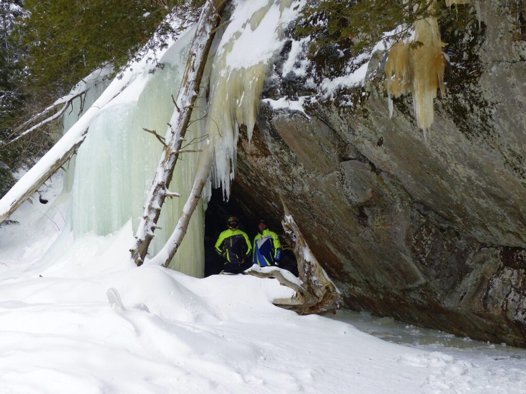 2 snowmobilers, ice caves, 