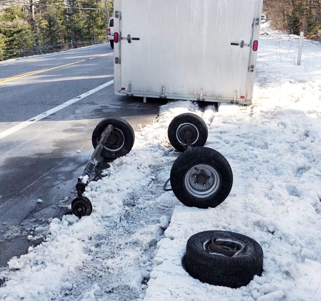 Broken axles due to snowmobile trailer roof snow overload
