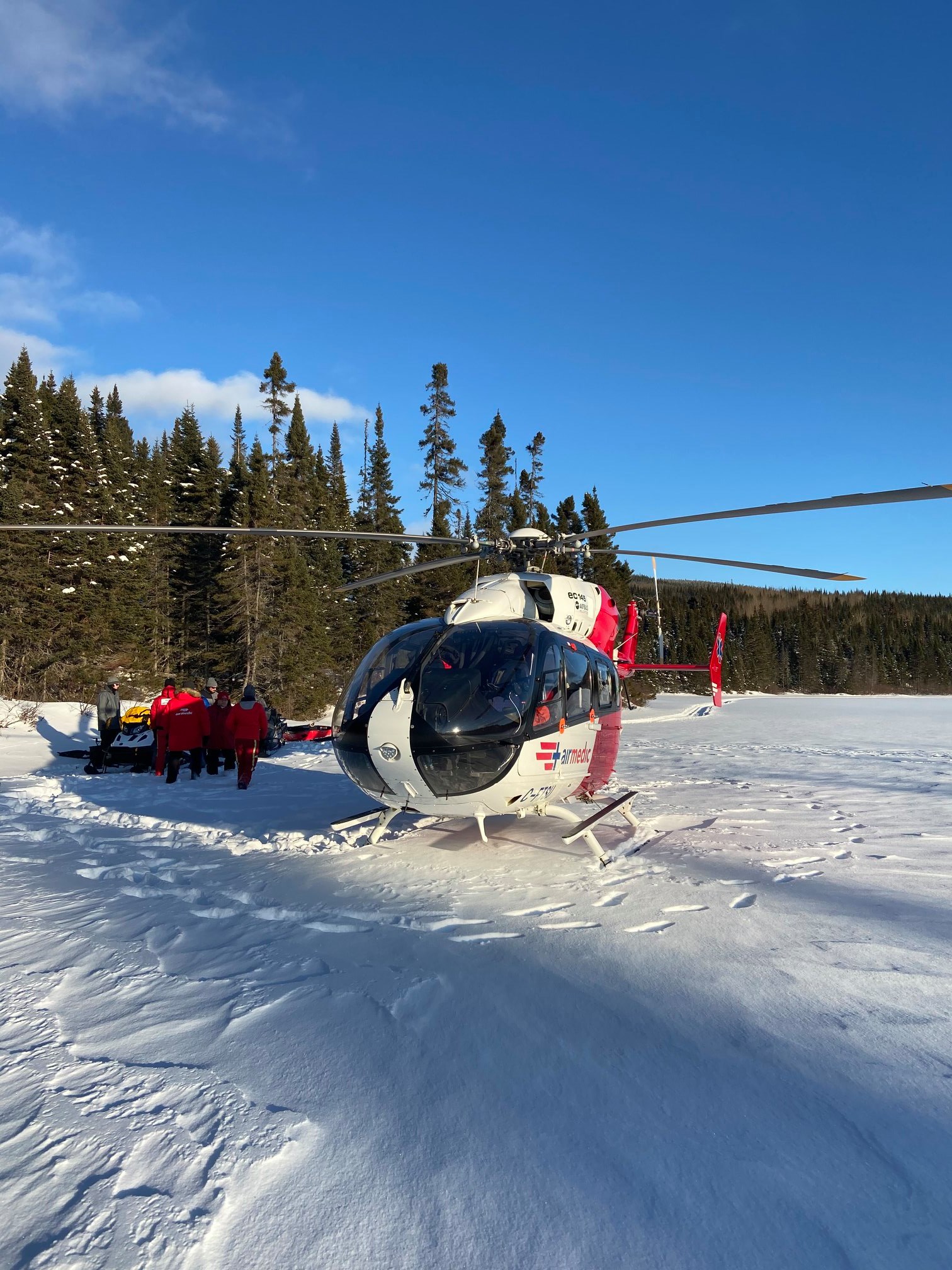 Quebec snowmobiler rescue provided by Air Medic helicopter flights to nearest hospital.