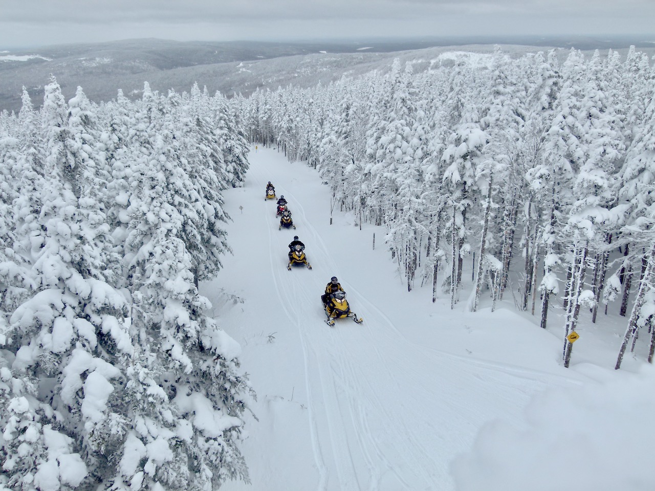 Snowmobiling thru the heart of the Appalachian Mountains in the Chaudière-Appalaches Region of Quebec.