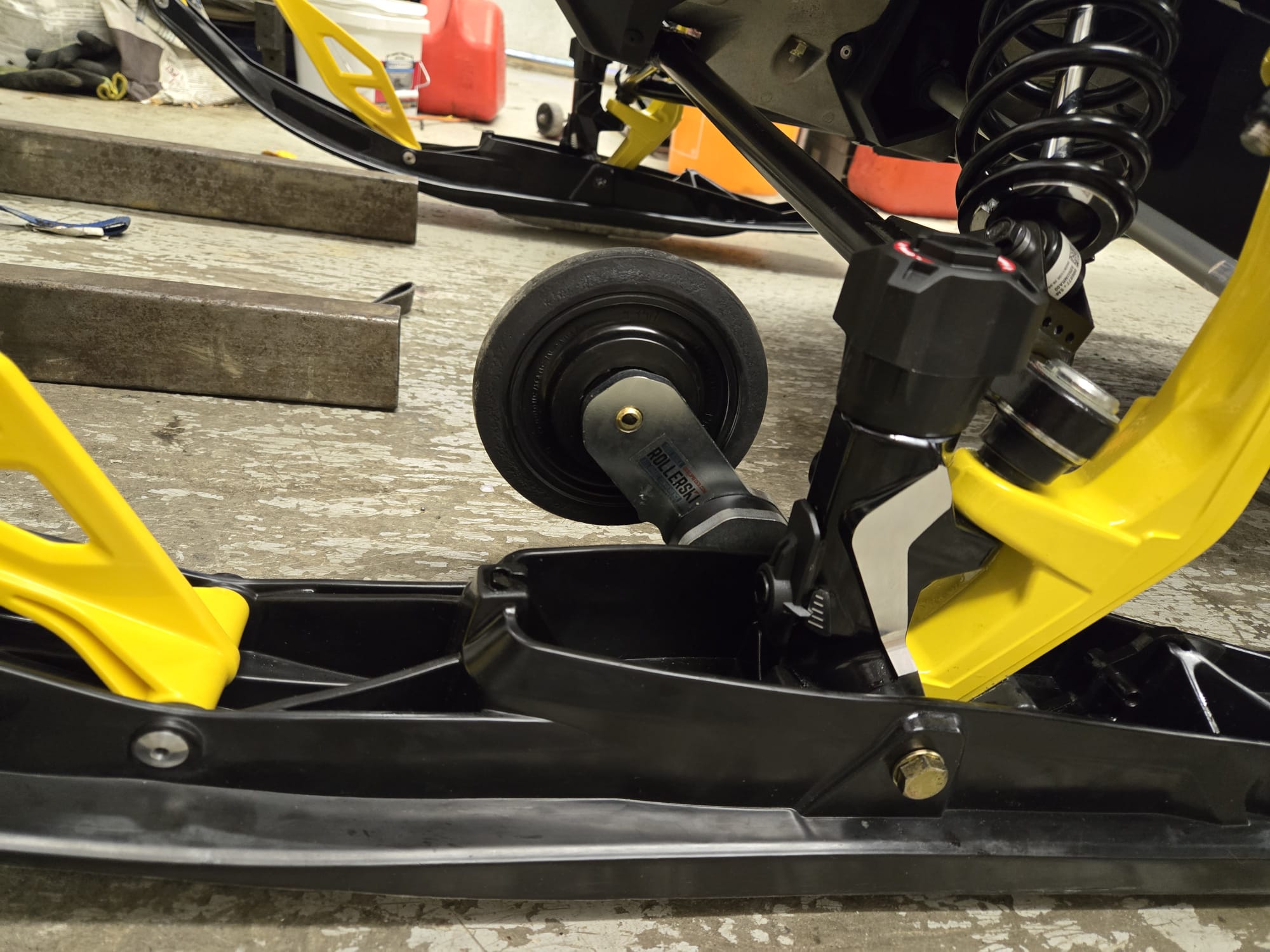 Snowmobile Rollerskis in process of installation with left ski completed.